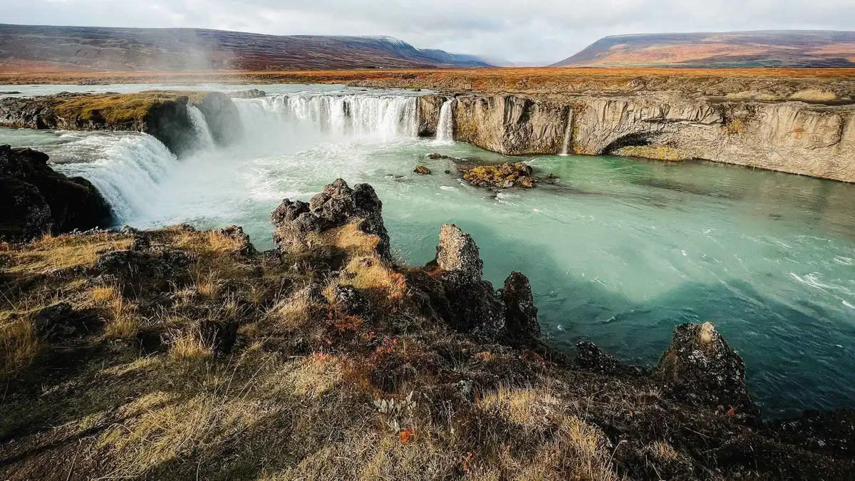 Milky blue water of the Myvatn Nature Baths above the lava field on a Lake Myvatn tour with baths, Iceland