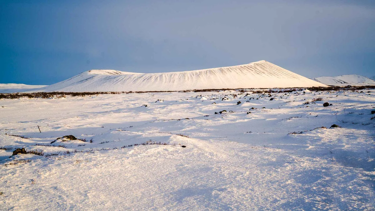 Snow over the lava field and steaming ground on a winter Lake Myvatn and Godafoss waterfall tour from Akureyri